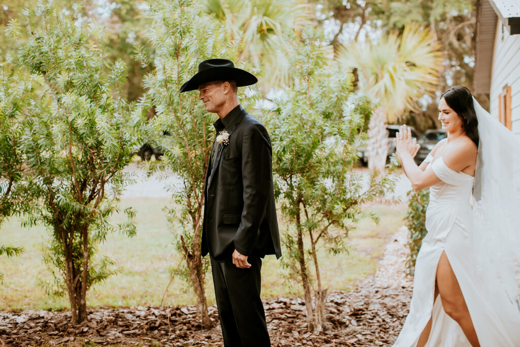 Bride and father sharing an emotional first look at Gentry Pines.