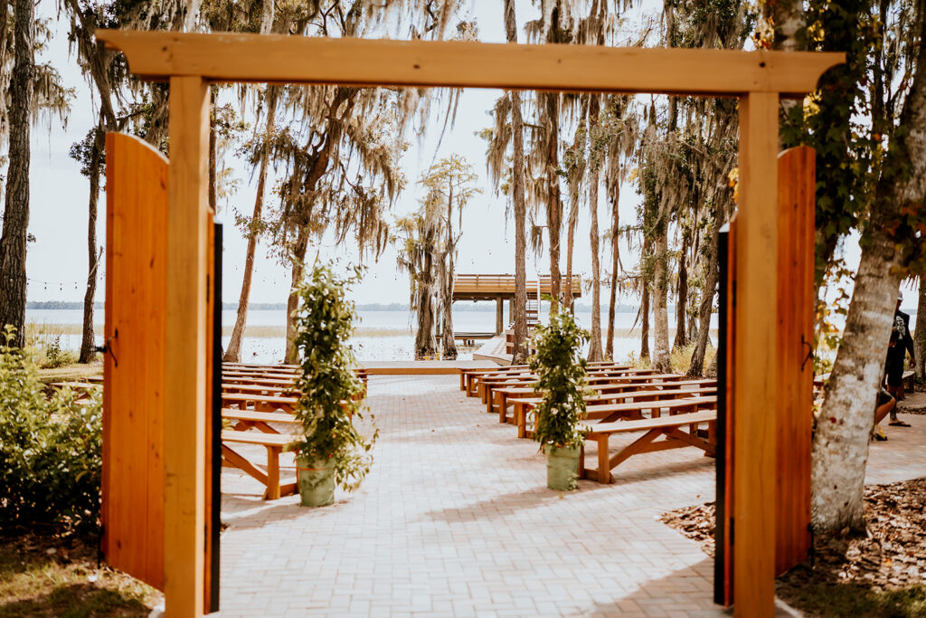 Gentry Pines Venue: Nestled in the heart of St. Cloud, Florida, this rustic-chic wedding destination features 7,000 square feet of open space surrounded by giant oaks draped in Spanish moss. Explore the captivating charm of Gentry Pines, where natural beauty meets timeless elegance.