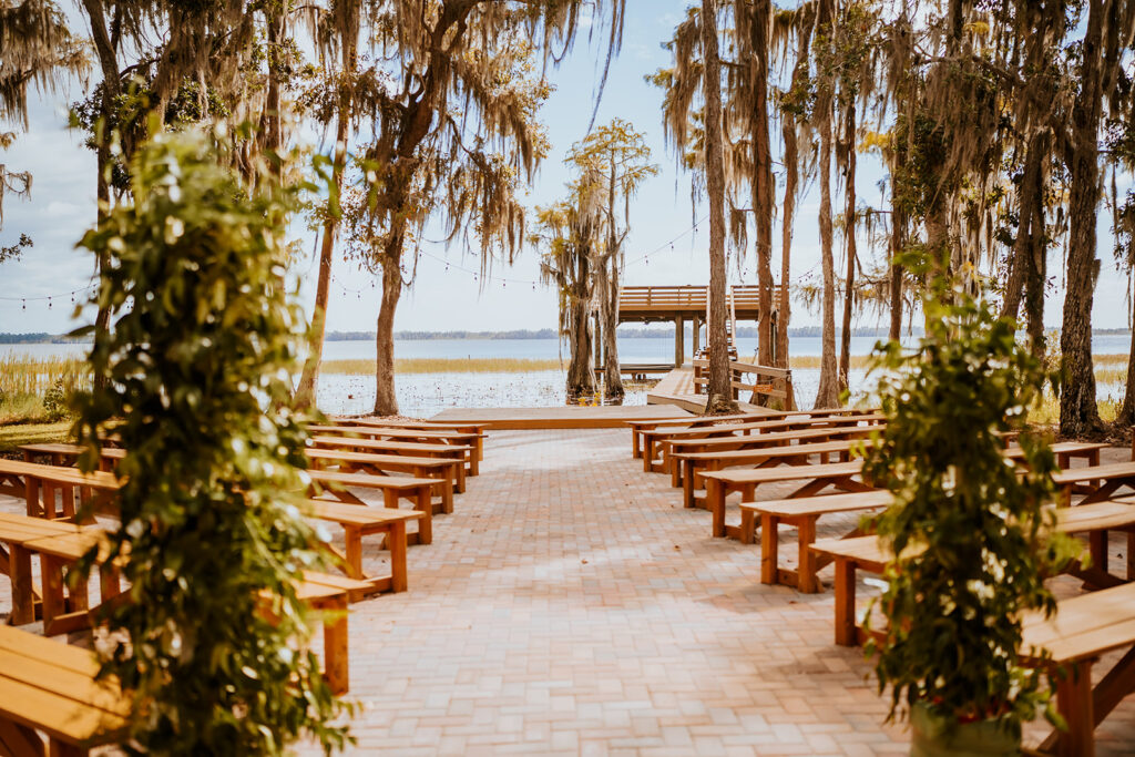 Gentry Pines Venue: Nestled in the heart of St. Cloud, Florida, this rustic-chic wedding destination features 7,000 square feet of open space surrounded by giant oaks draped in Spanish moss. Explore the captivating charm of Gentry Pines, where natural beauty meets timeless elegance.