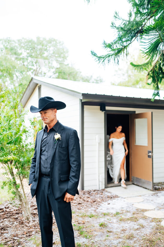 Bride and father sharing an emotional first look at Gentry Pines.