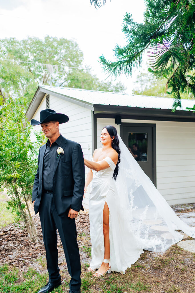 Bride and father sharing an emotional first look at Gentry Pines.