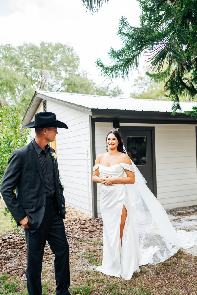 Bride and father sharing an emotional first look at Gentry Pines.