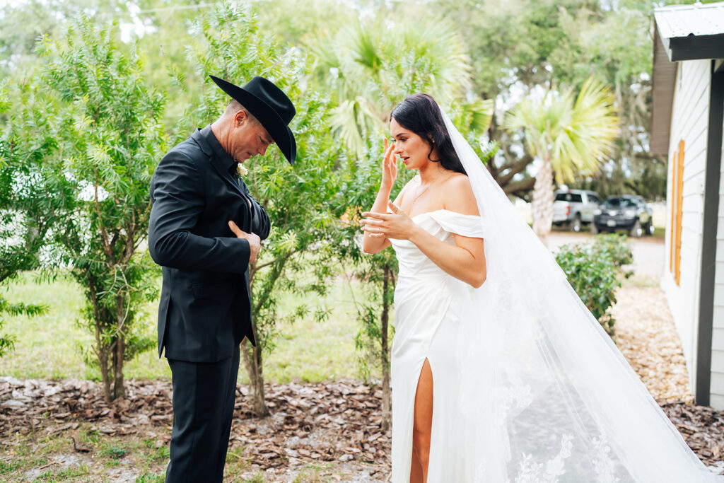 Bride and father sharing an emotional first look at Gentry Pines.